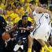 Illinois Tracy Abrams looks to pass against Michigan defenders on Sunday, Feb. 24. Daniel Brenner I AnnArbor.com